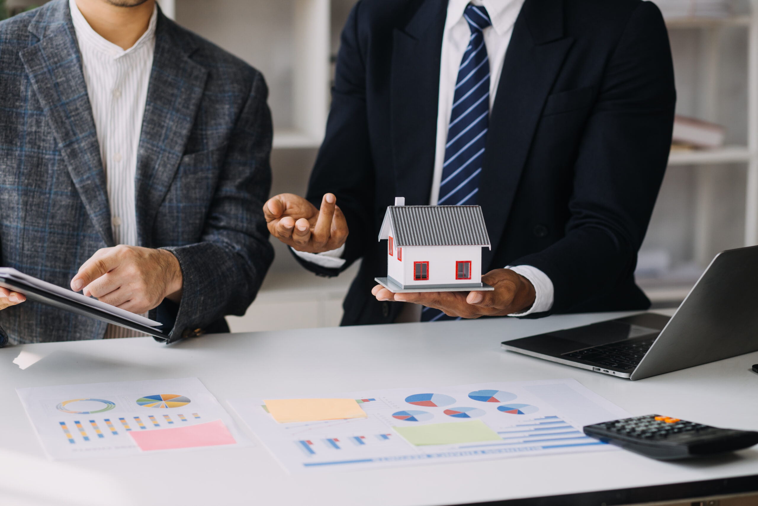 Business Signing a Contract Buy - sell house, insurance agent analyzing about home investment loan Real Estate concept.